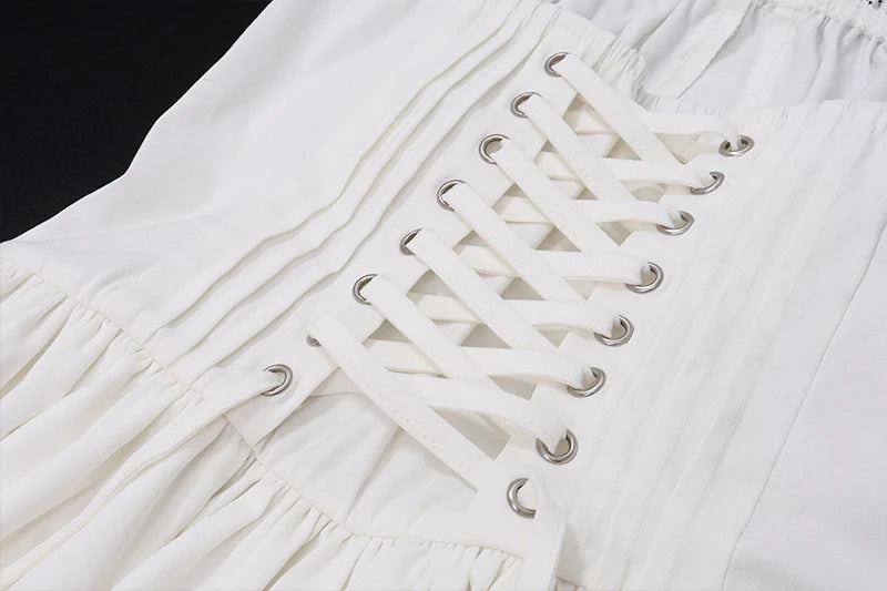 Vestido Mini Plissado Off-Shoulder.